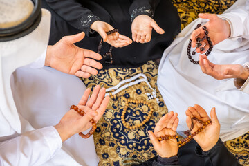 Arabic muslim family praying for god