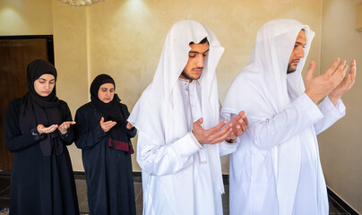 Arabic muslim family praying for god