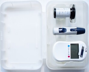 Diabetes testing kit with monitor devise, picker and lancets