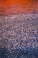 Detail of a colourful stone that resembles a retreating sea at Palm Valley in the West MacDonnell Ranges, Northern Territory, Australia.