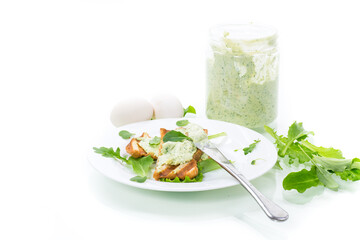 green bread spread of arugula, curds and eggs with fried toast