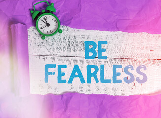 Writing note showing Be Fearless. Business concept for act of striving to lead an extraordinary...