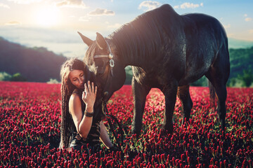 Portrait woman and horse outdoors. Woman hugging a horse.