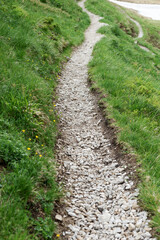 Fototapeta na wymiar Closeup of path for pedestrians with bright small pebbles