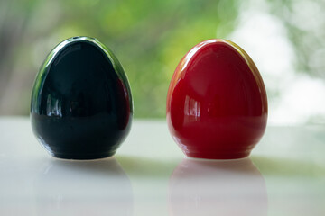 Black and red of egg shape ceramic shakers for salt or pepper