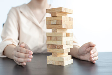 Businessman playing a wooden game in his office.