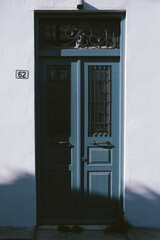 blue door in front of an old house