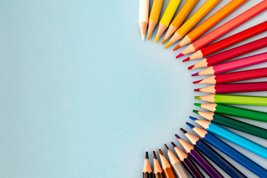 A Spectrum Of Colourful Pencils Spread Out On A Table 