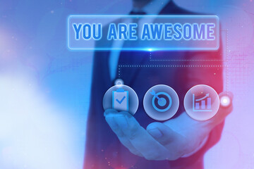 Writing note showing You Are Awesome. Business concept for Motivation, appreciation, admiration,...