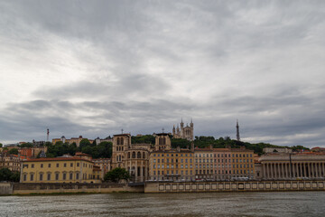 Obraz premium Lyon, France - CIRCA 2019: Picturesque historical Lyon Old Town buildings on the bank of Saone River. Lyon, Region Auvergne-Rhone-Alpes, France.