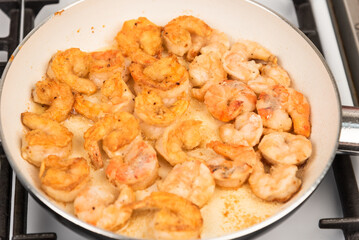 Shrimps fried in a pan - close-up, top view