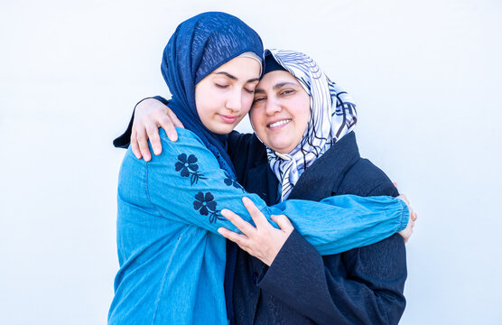 Arabic Muslim Daughter Hugging Her Mother