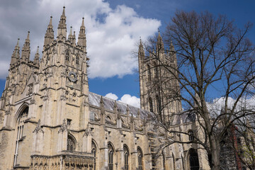Fototapeta na wymiar Canterbury Cathedral in early spring with blue sky and clouds