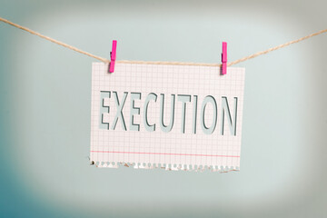 Text sign showing Execution. Business photo text it executes or imposes a program order or course...
