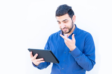 Arabic guy talking online on his tablet