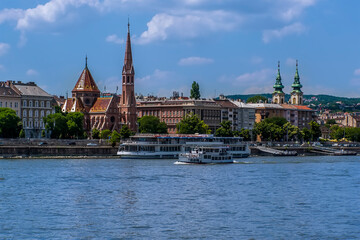 Fototapeta premium A view of the west bank of the River Danube in Budapest from a boat on the river during summertime