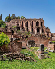 Rome Italy, impressive ruins of Domus Tiberiana in the Roman forum under clear blue sky