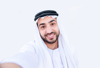 Fototapeta premium Arabic guy taking selfie and smiling