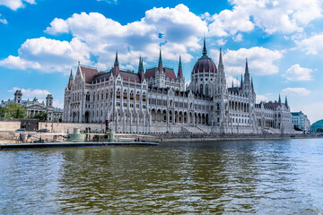 A view of the Parliament Building in Budapest from a boat on the River Danube during summertime