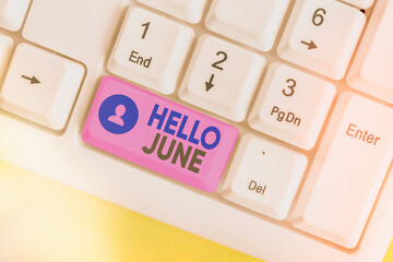Conceptual hand writing showing Hello June. Concept meaning a new month to plan your activities for fun and adventures White pc keyboard with empty note paper above white key copy space