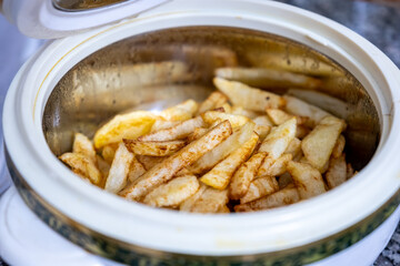 Bowl of fried potatoes ready for iftar