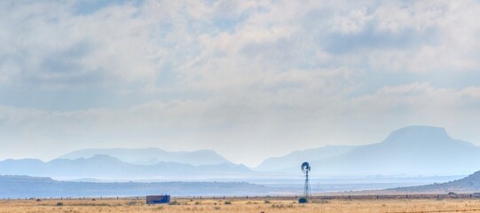 KAROO WINDMILL. the karoo is a semi desert, arid basin. Prone to drought and long dry spells. Eastern cape, South Africa.