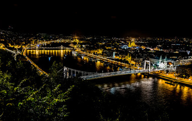Fototapeta na wymiar A panorama view up the River Danube from the foot of the Liberty Statue at night in the summertime