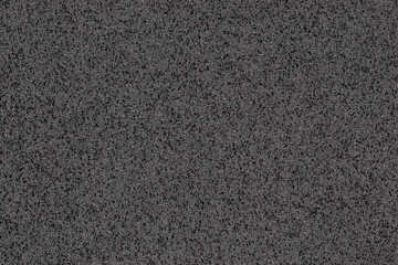 A macro photo of a black gradient color with texture from real foam sponge paper for background, backdrop or design.