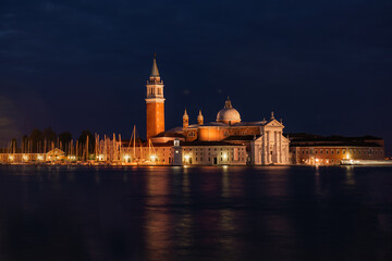 Church of San Giorgio Maggiore at night with city lights, Venice