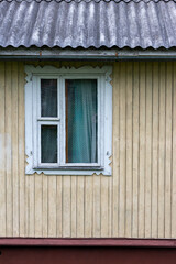 Window in the cottage. Window in a rural house.