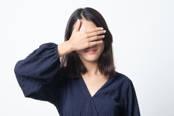 Young Asian woman close her eyes with hand.