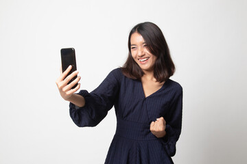 Successful young Asian woman with mobile phone.