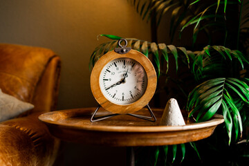 vintage clock on a wooden table