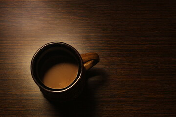cup of coffee or tea on wooden background