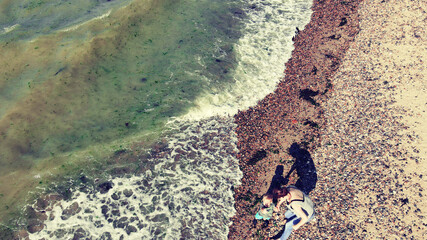Toddler with Nan on Beach walk near Beltinge on the Kent Coast. 