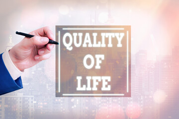Conceptual hand writing showing Quality Of Life. Concept meaning Family People Feelings Expression,...