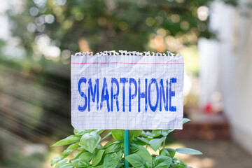 Handwriting text Smartphone. Conceptual photo a mobile phone that performs many of the computer s...