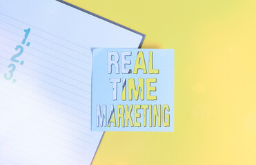 Conceptual hand writing showing Real Time Marketing. Concept meaning business strategy focused on...