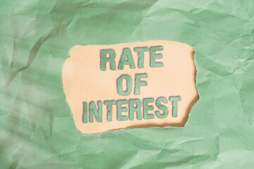 Writing note showing Rate Of Interest. Business concept for Percentage computed from principal...