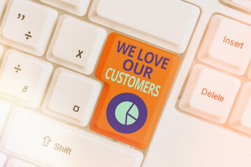 Conceptual hand writing showing We Love Our Customers. Concept meaning clients care and attention...