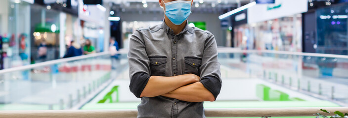 Man wearing mask for protect Novel Coronavirus:2019 or PM 2.5 dust and serious of the air pollution in department store.