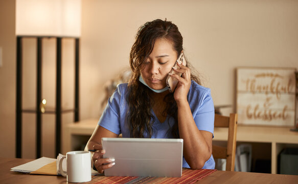 Filipina Nurse Working From Home Talking On Phone