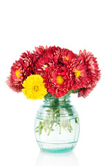 Huge bunch of yellow and red autumn flowers in vase,  Beautiful flowers isolated on white background