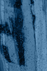 Blue textured grunge glass closeup background