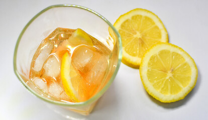 Refreshing light delicious summer aperol cocktail with ice and lemon in a glass isolated on white