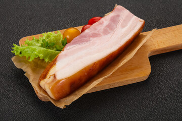 Smoked pork breast with salad leaves