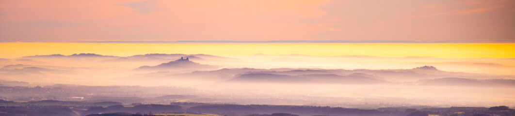 Fototapeta premium Trosky castle ruins rising from the mist. Weather temperature inversion, Czech Republic