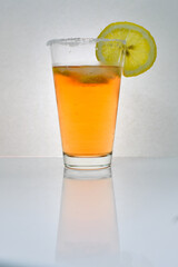 Refreshing light delicious summer aperol cocktail with ice and lemon in a glass isolated on white