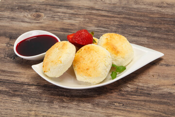 Curd pancakes with jam and stravberry