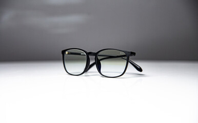 black-rimmed glasses isolated on white - gray background